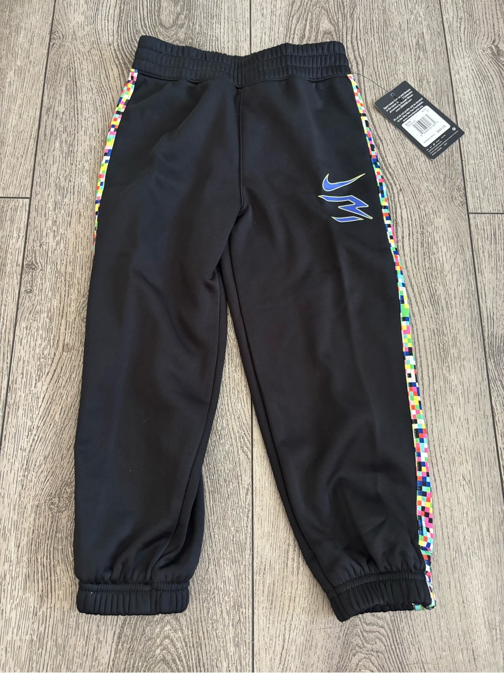 Nike Black Joggers with Multicolor Pixel Side Stripes